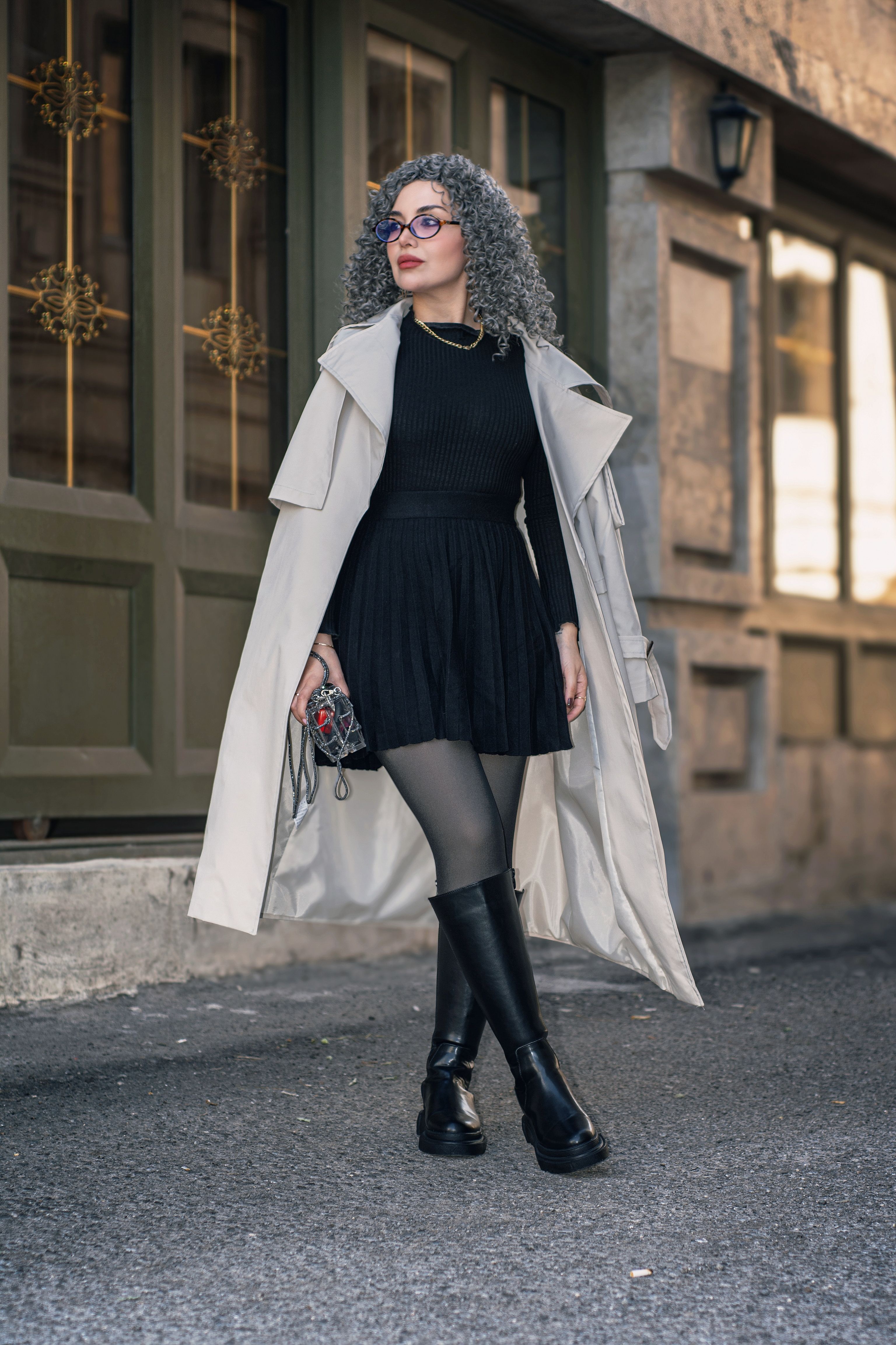 Stylish Woman in Trench Coat Walking on Urban Street · Free Stock Photo