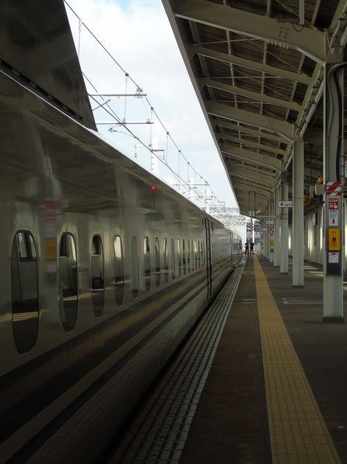 Free High-speed train at station platform with modern architecture, showcasing urban travel and transportation. Stock Photo