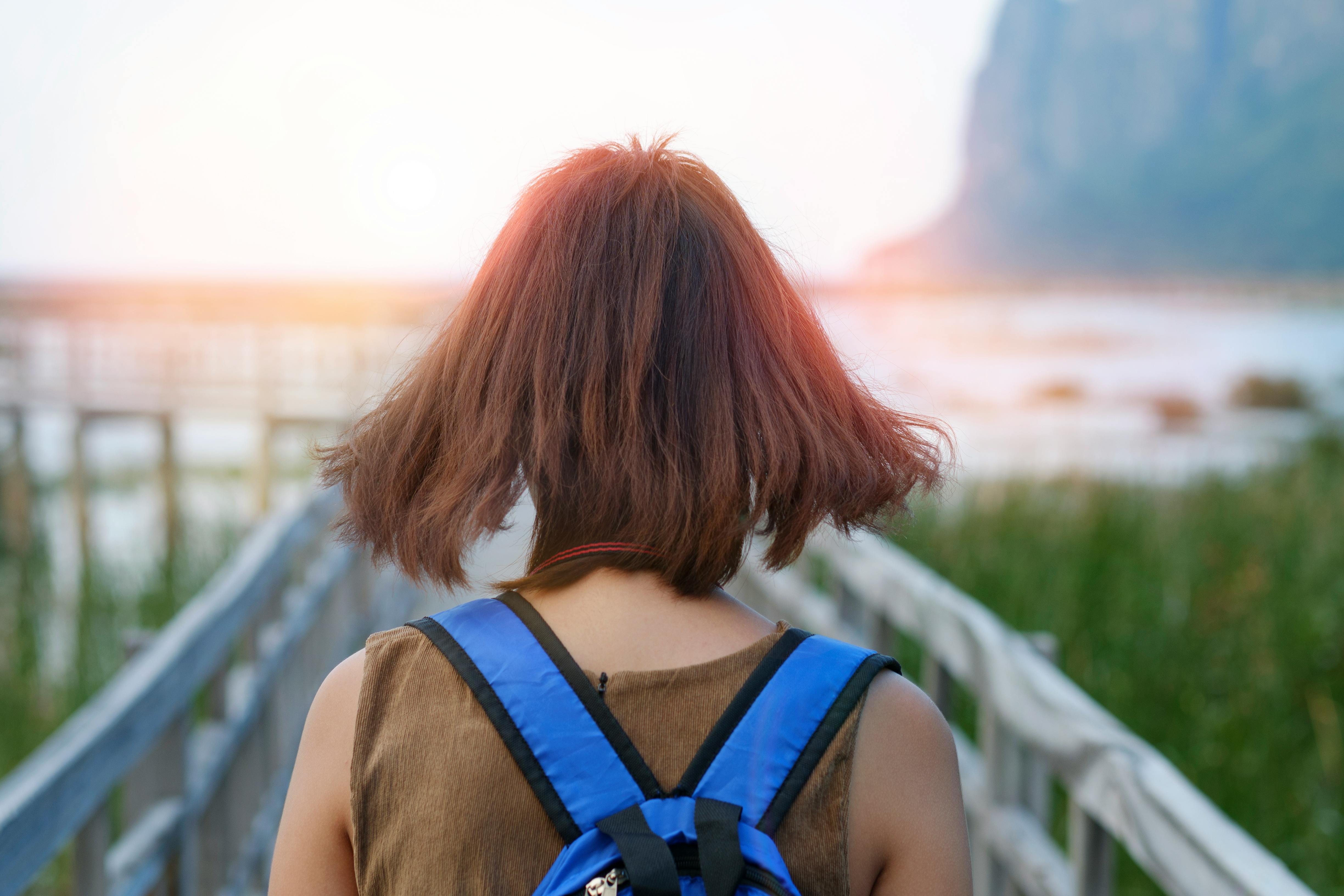 Woman Walking On A Wooden Bridge Free Stock Photo