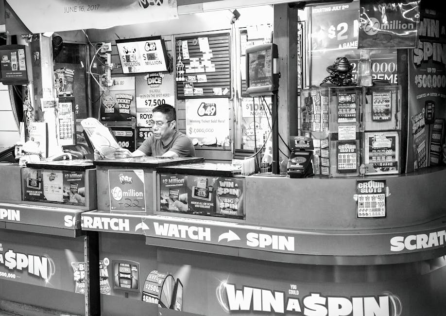 A man reads at a busy lottery ticket booth filled with signs and advertisements.