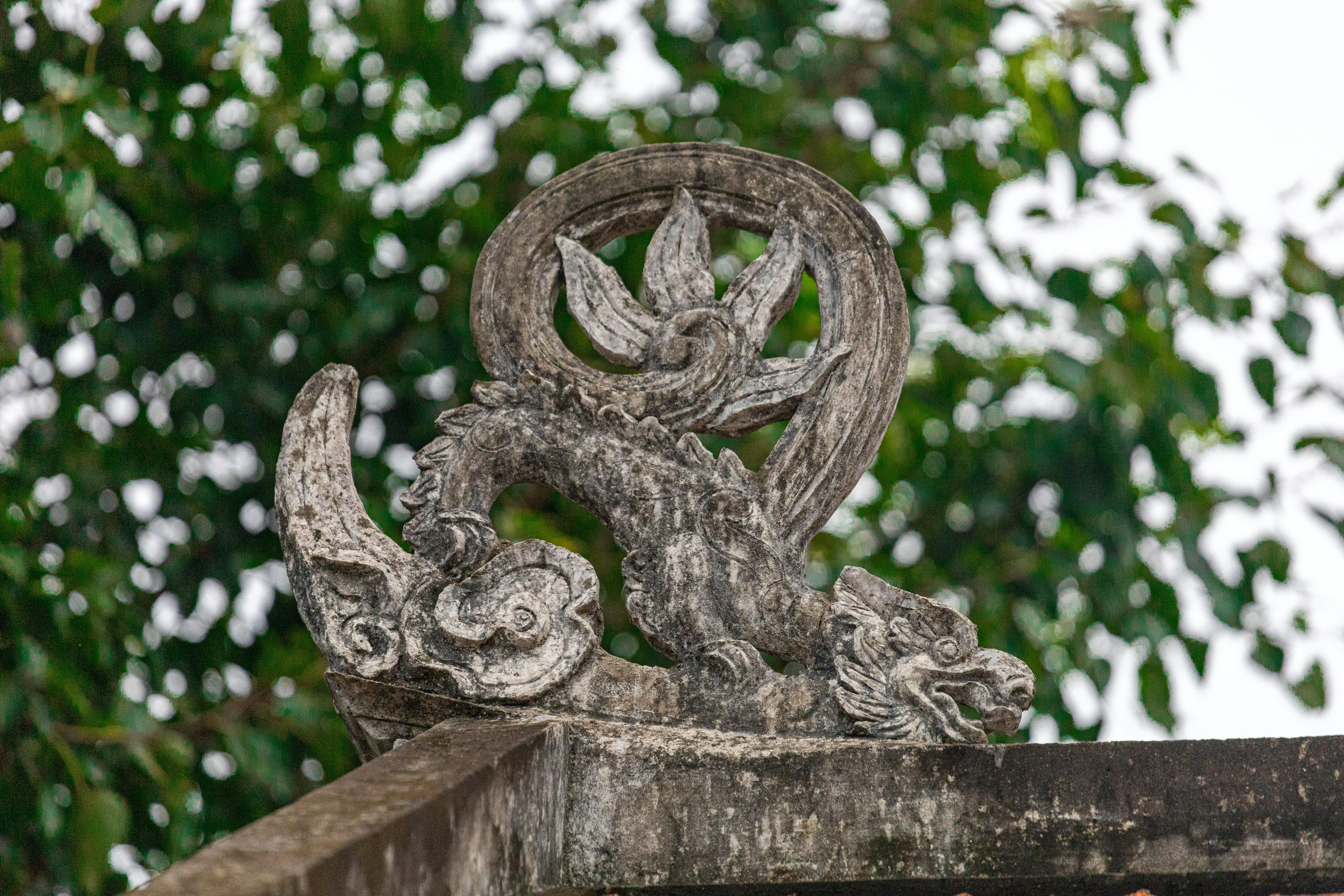 Stone dragon sculpture at a historic temple in Hà Nội, Việt Nam.