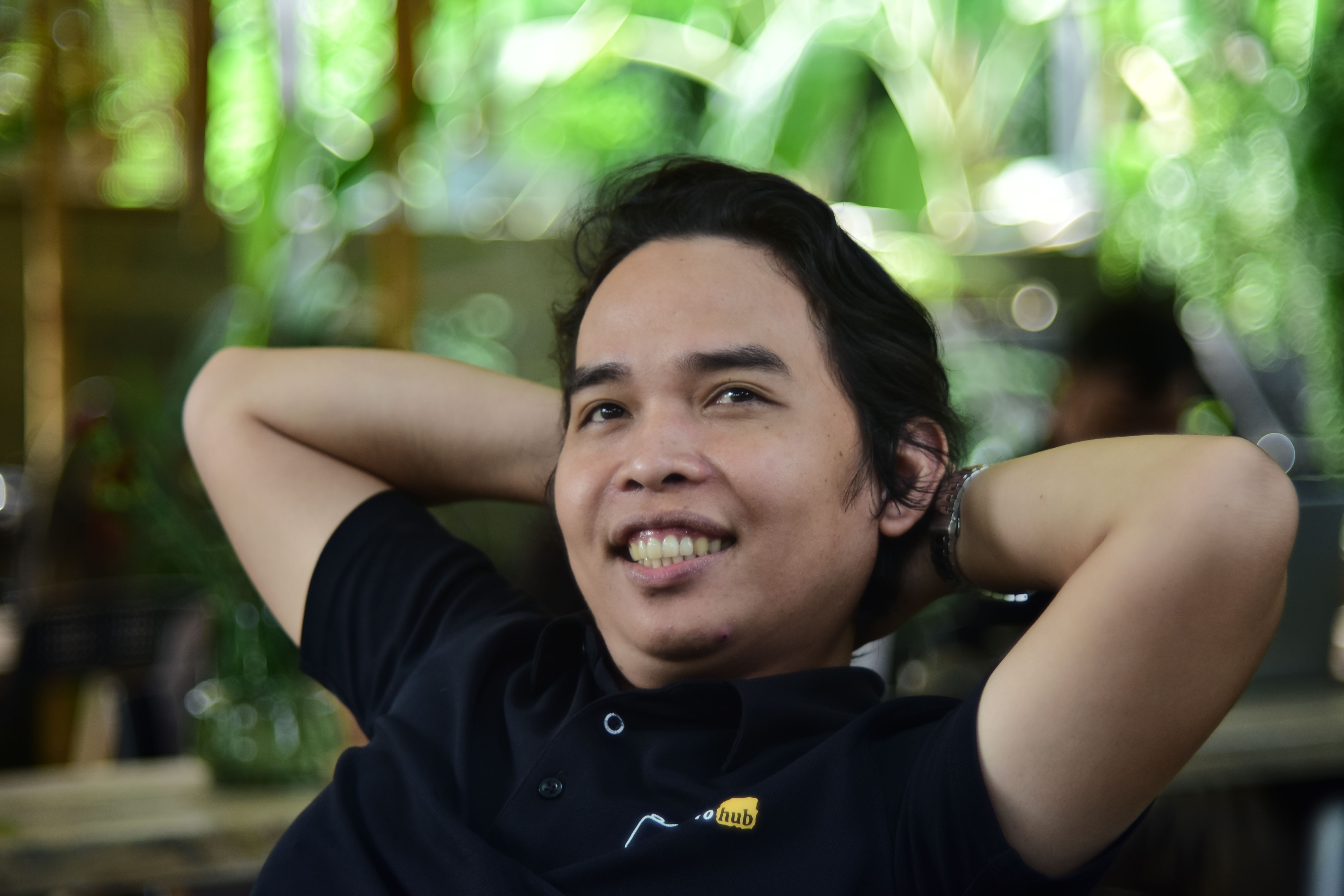 Smiling Man Relaxing Outdoors in Casual Shirt