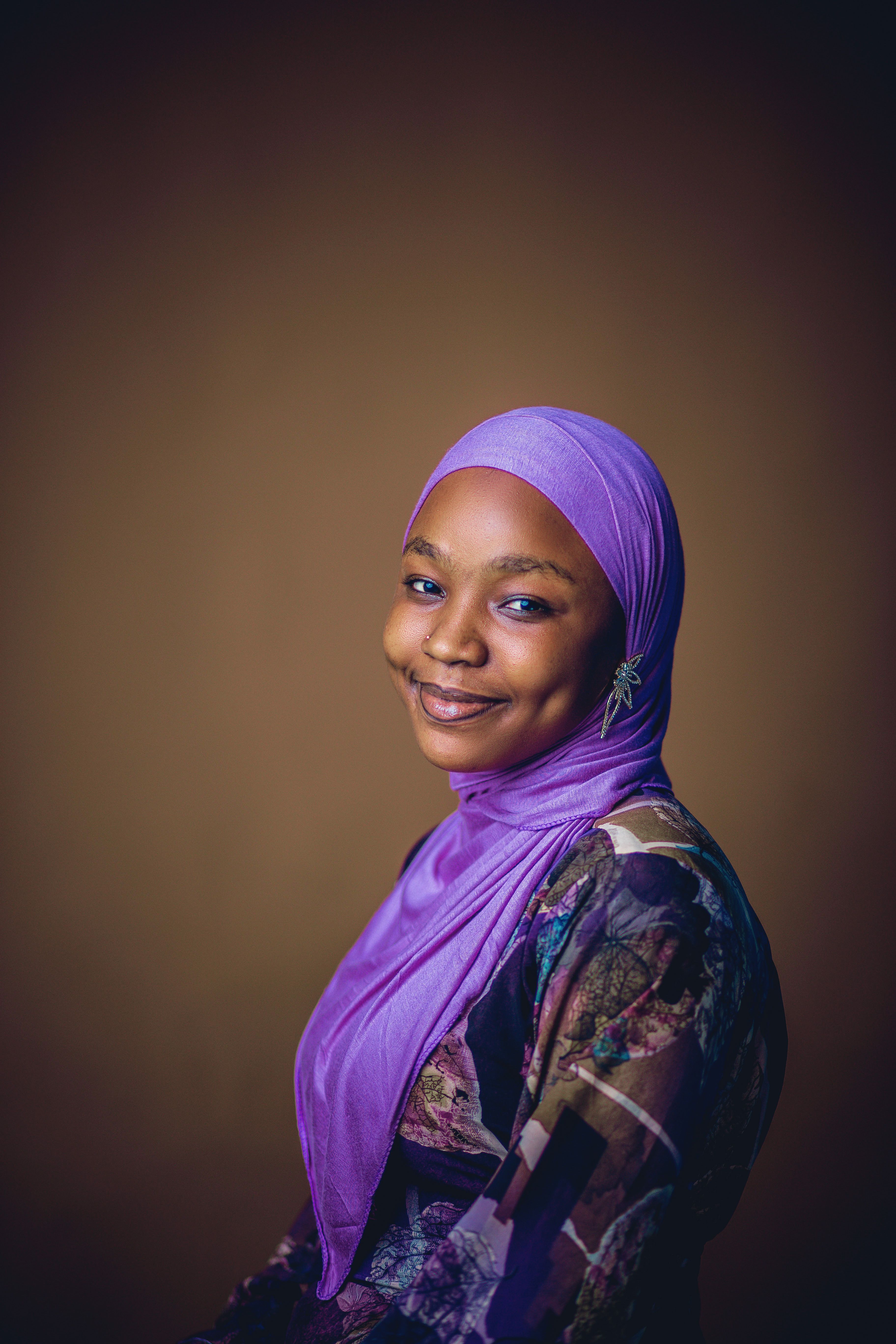 Elegant Portrait of Woman in Purple Hijab · Free Stock Photo