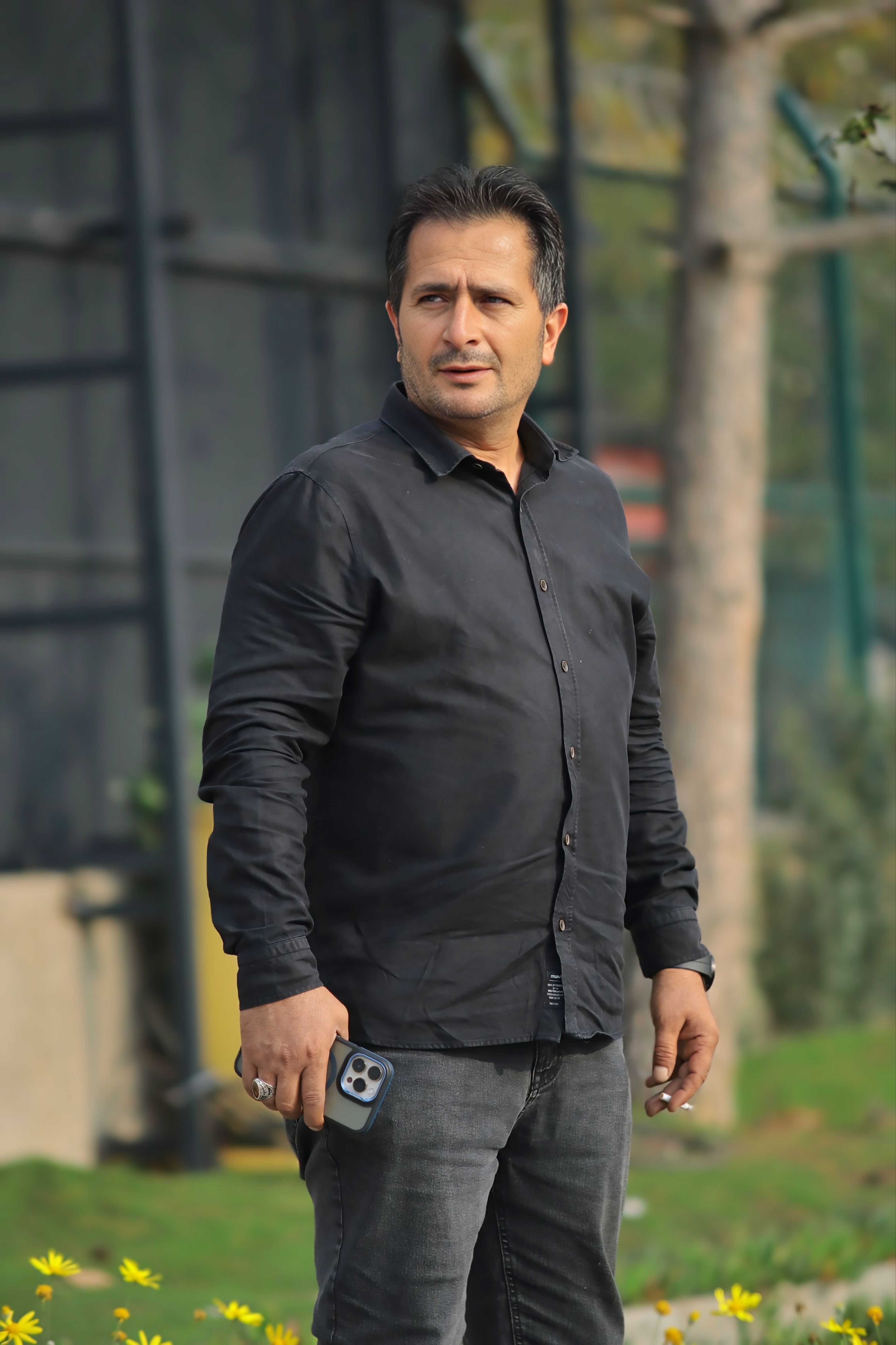Casual Portrait of Man Outdoors with Smartphone