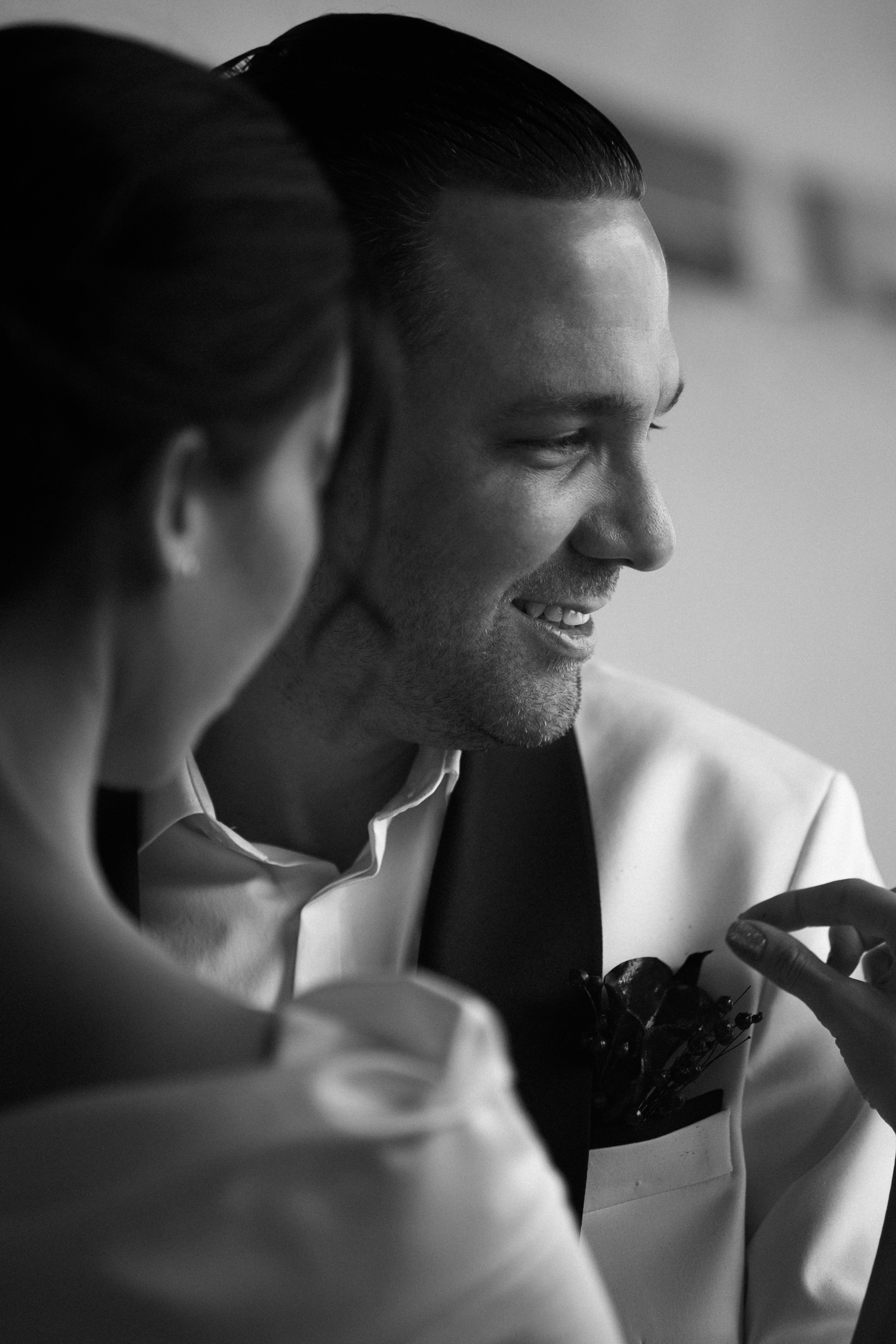 Classic black and white portrait of a joyful couple at their wedding.
