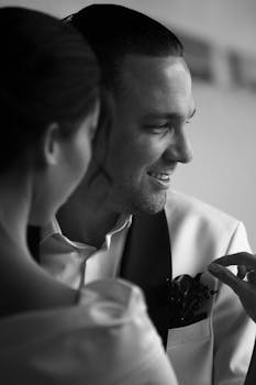 Classic black and white portrait of a joyful couple at their wedding.
