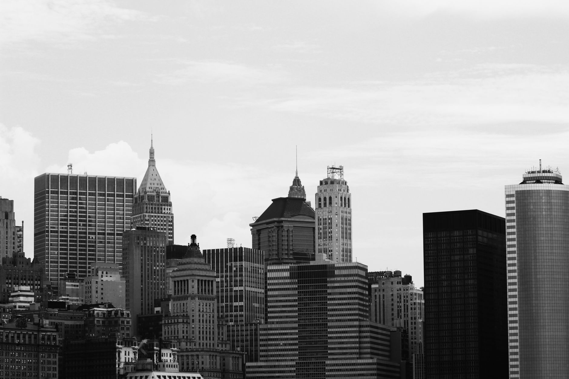 Black and white image of New York City's iconic skyline featuring classic architecture.