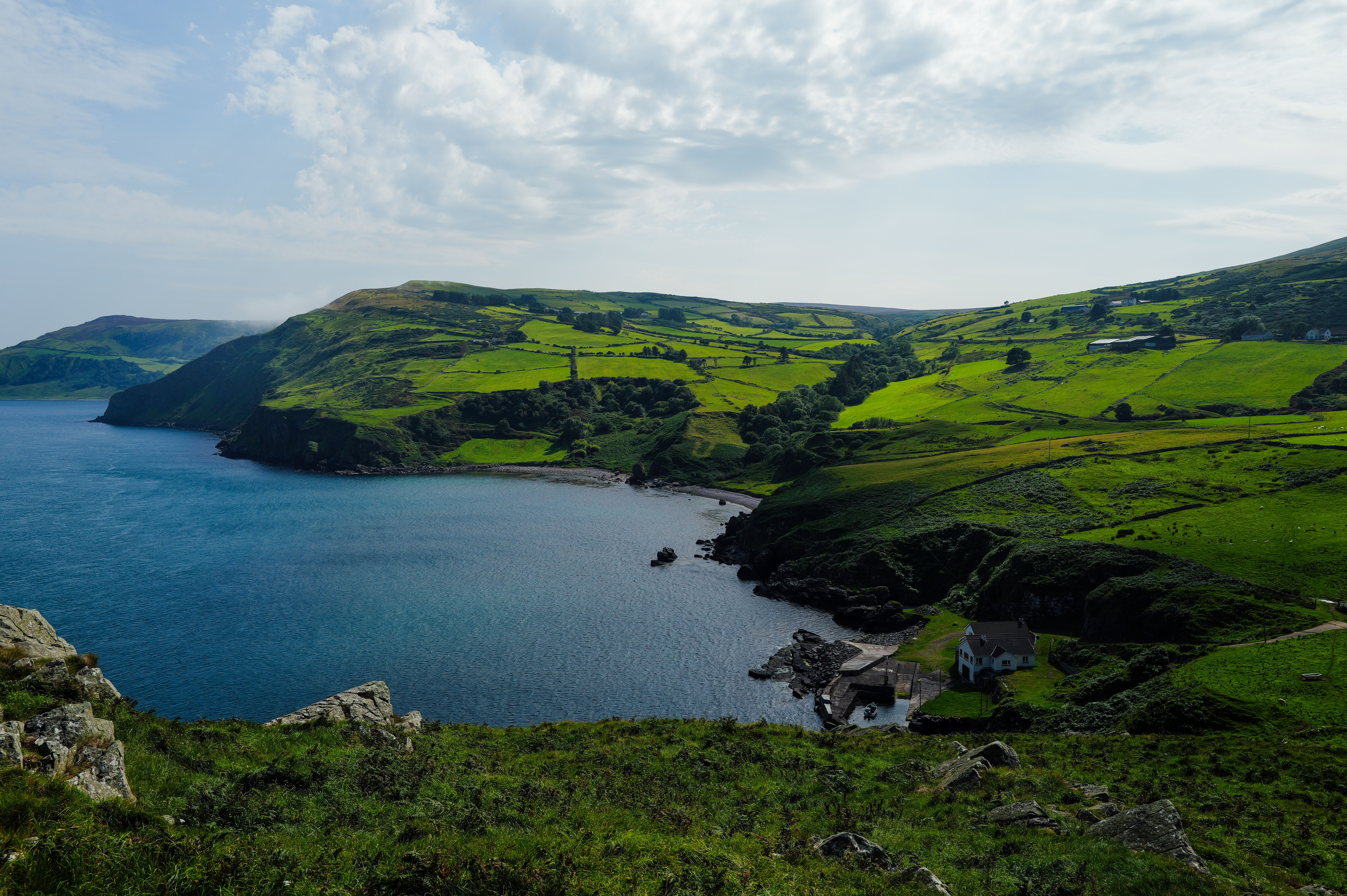 Stunning Coastal Landscape of Green Hills and Sea · Free Stock Photo