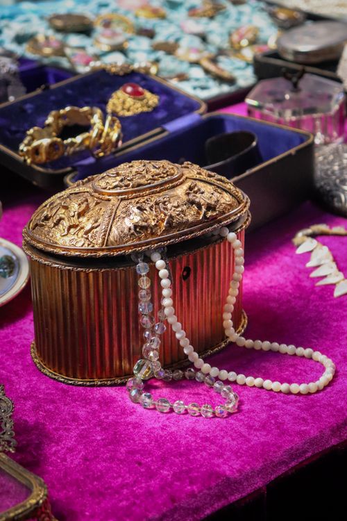 Free Ornate gold antique jewelry box adorned with pearls on a velvet surface, showcasing luxury and elegance. Stock Photo