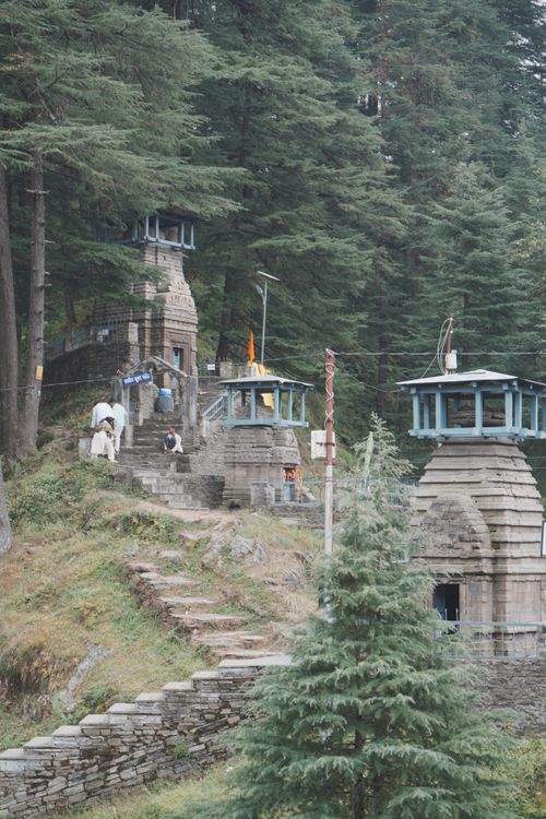 Ancient Stone Temples Amidst Evergreen Forest · Free Stock Photo