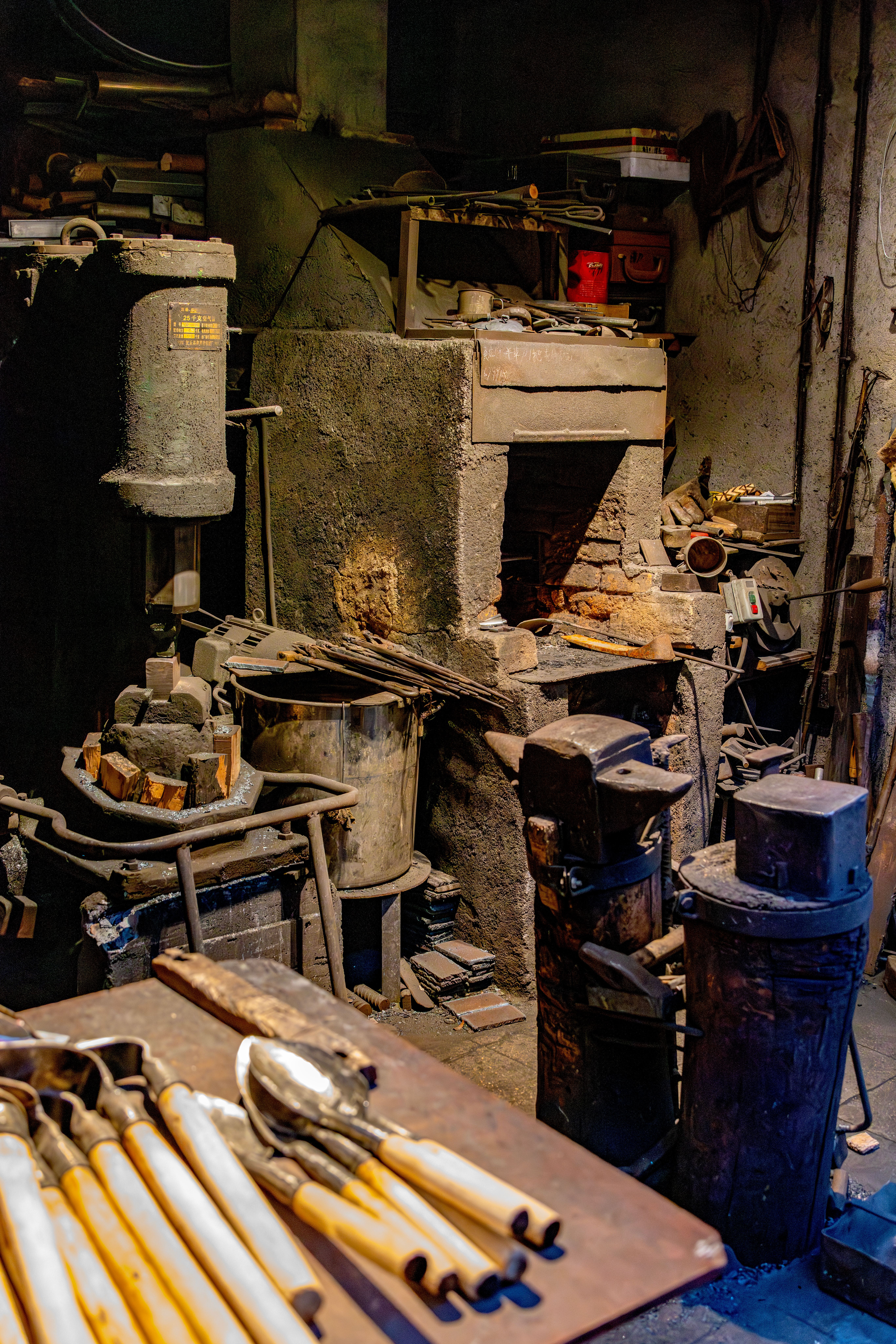 Cozy interior of a blacksmith's workshop with vintage tools and a glowing forge.