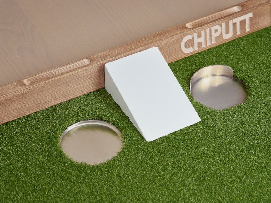 Enhance your golf skills with this innovative chip and putt training aid featuring artificial turf and multiple practice holes.