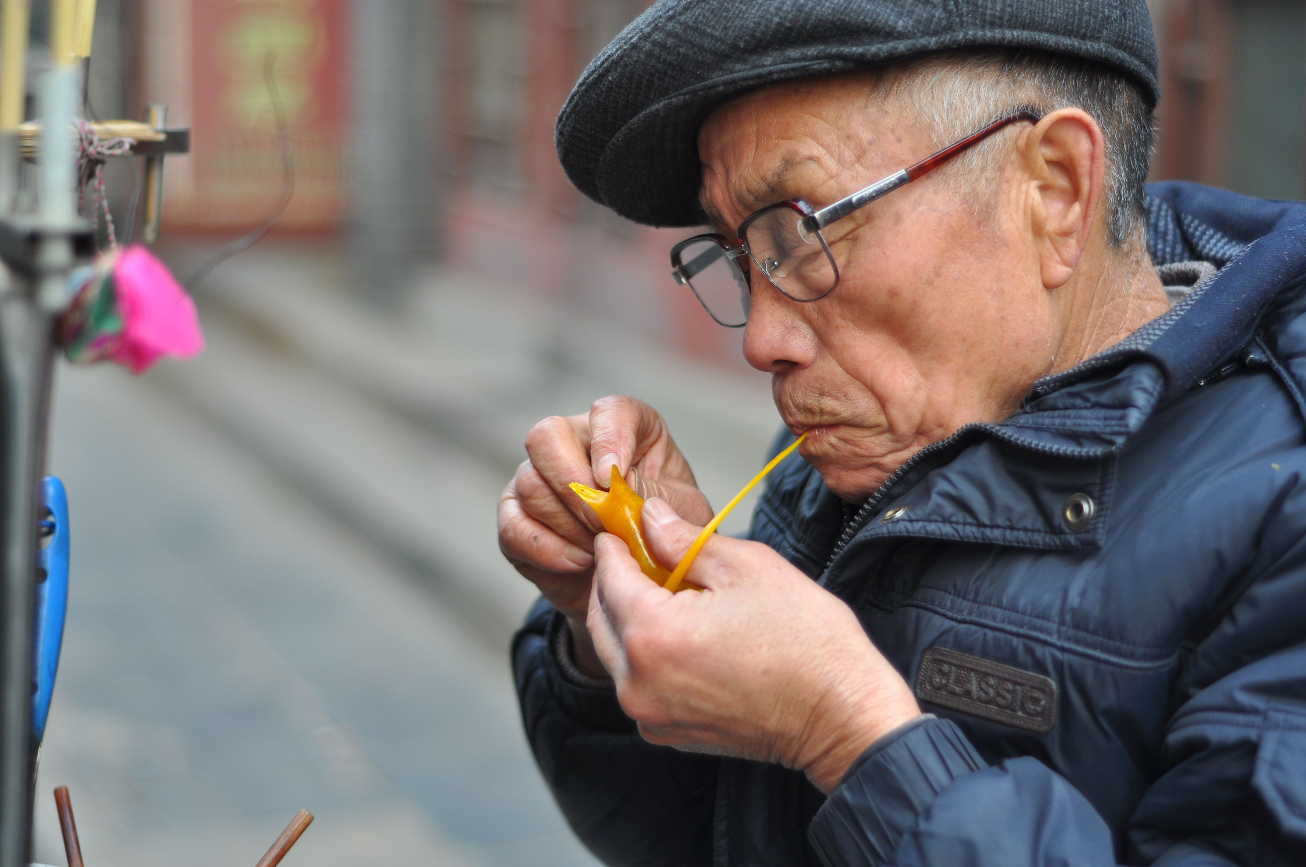 Elderly Man Crafting with Traditional Tools · Free Stock Photo