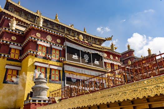 Richly decorated Tibetan monastery exterior with vibrant colors and intricate designs.