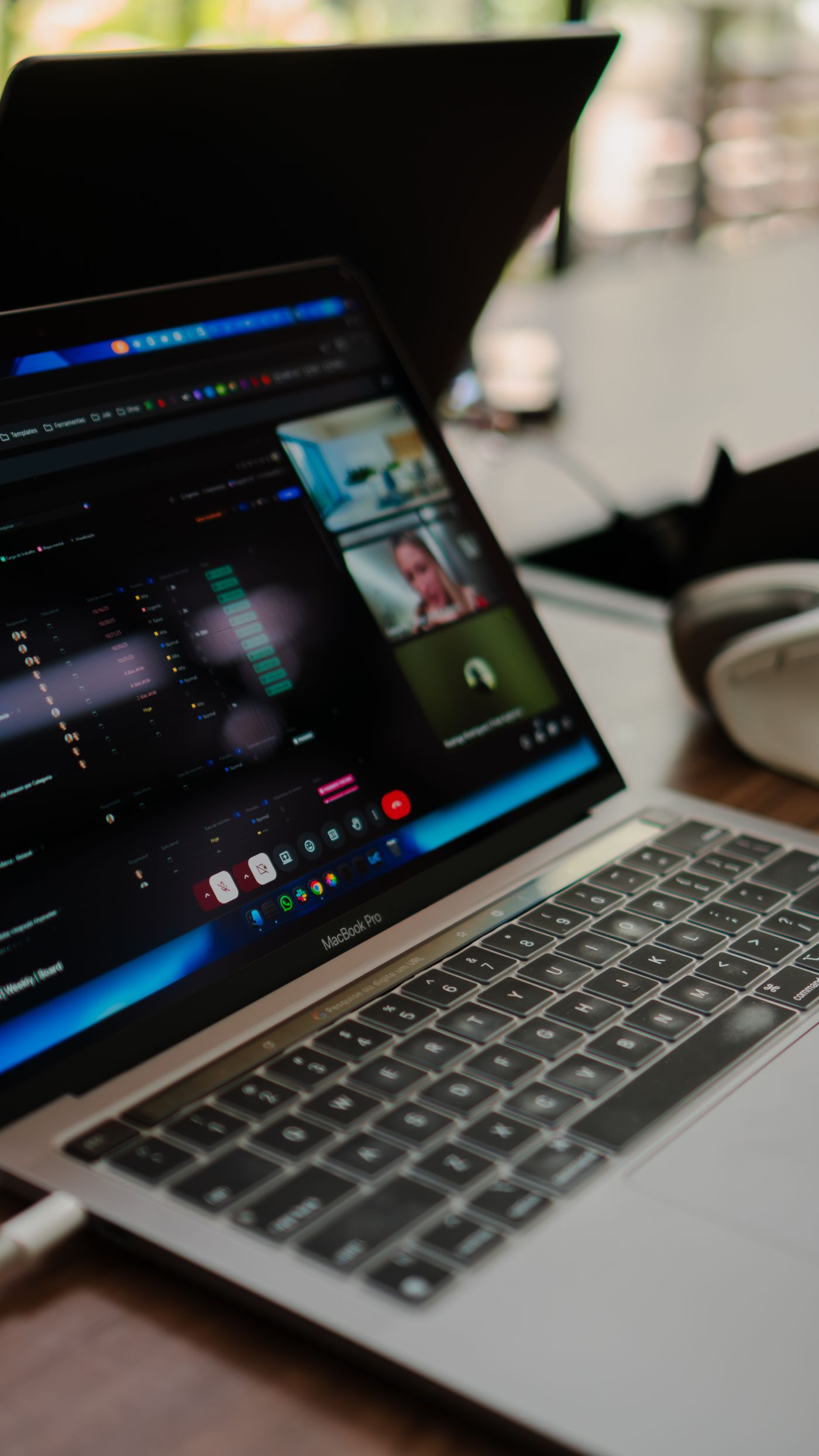 Open laptop displaying a video conference in a digital workplace