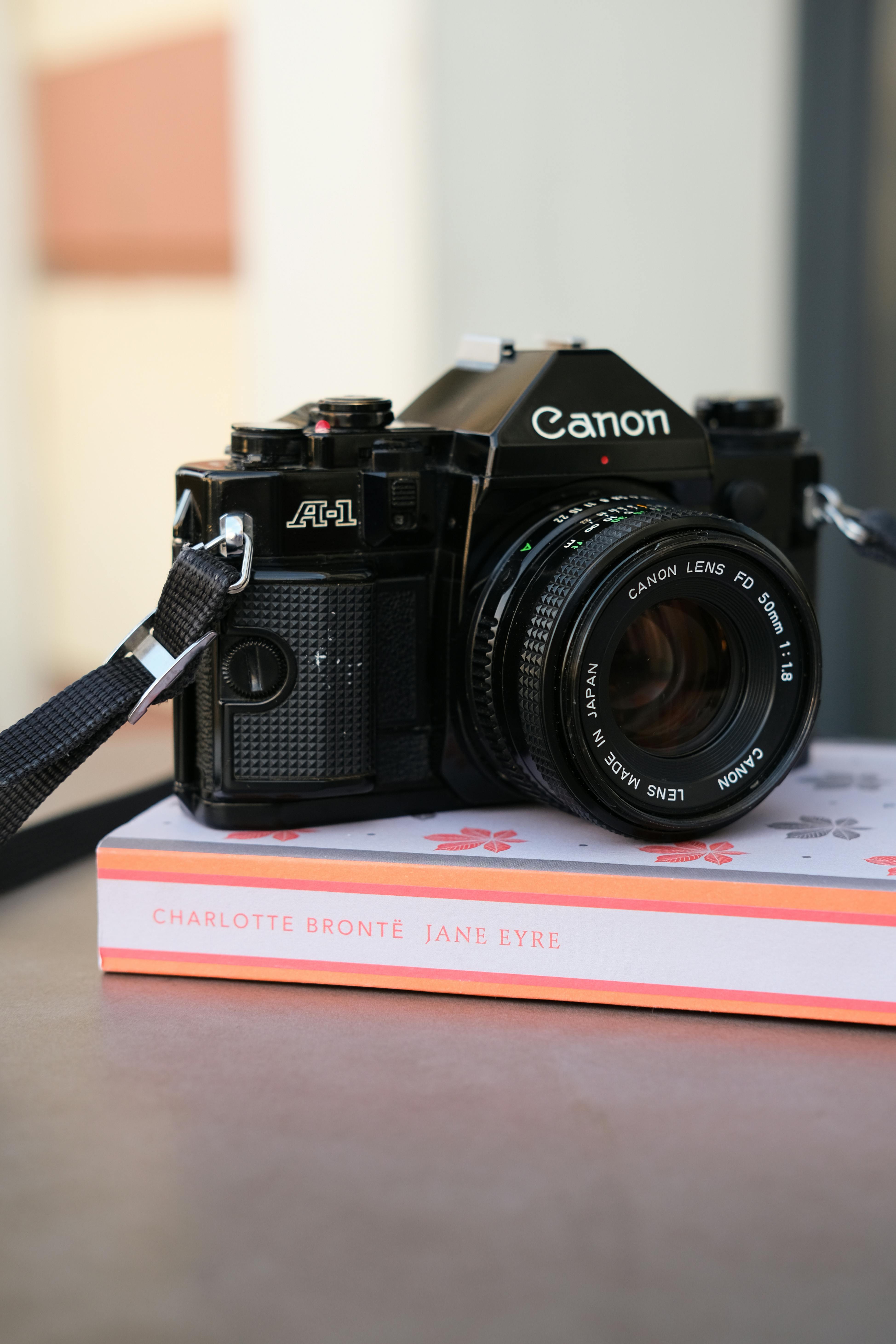 Canon A-1 film camera resting on Jane Eyre book, shot in İstanbul.