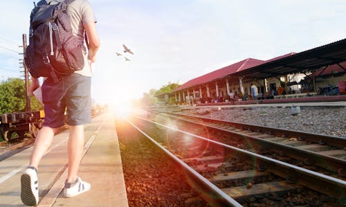 Man Walking Beside the Railway