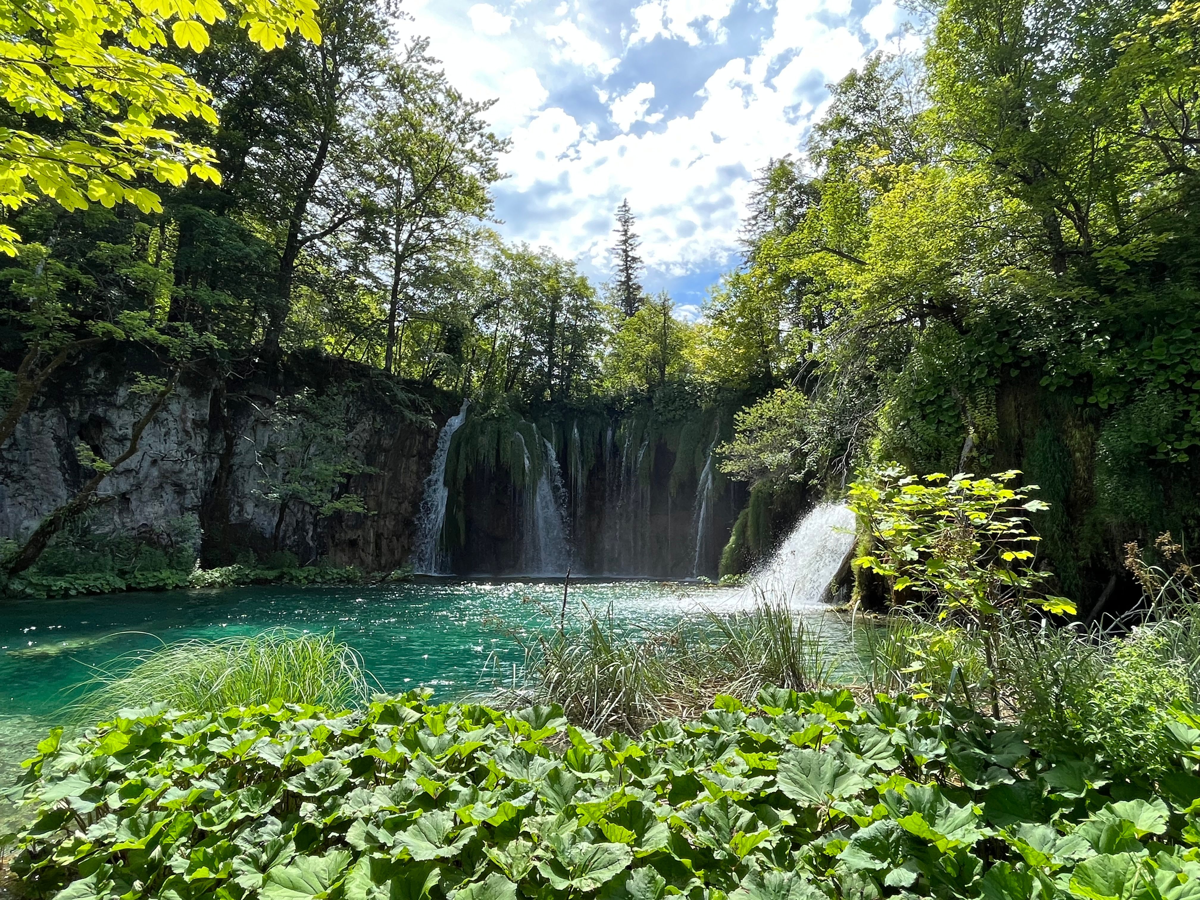 Emerald green lakes and cascading waterfalls at Plitvice Lakes National Park, Croatia.