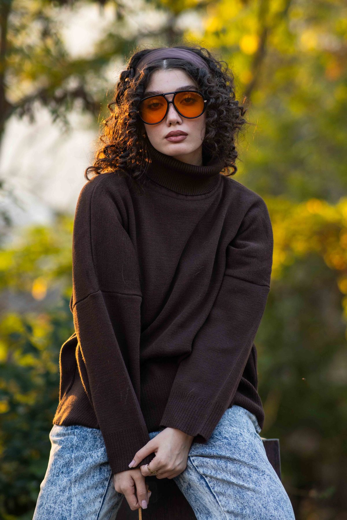 Brown Outfit Ideas for Fall — Camel, Chocolate and Cream Looks for Women Woman in a brown knit sweater in an autumn setting