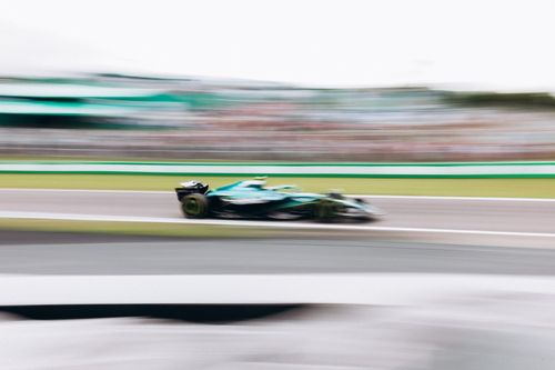 Free Blurred shot of a Formula 1 car racing at high speed during a race in São Paulo, Brazil. Stock Photo
