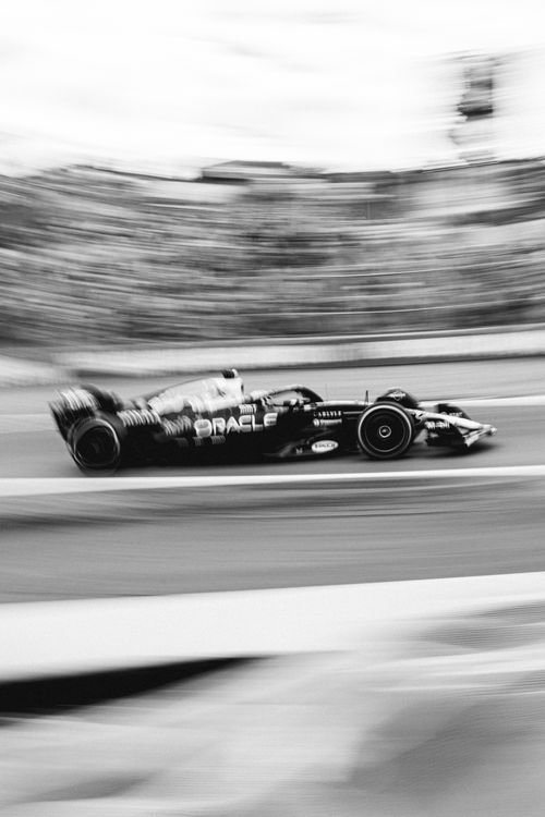 Free Black and white photo of a Formula 1 car racing in São Paulo, Brazil, capturing speed and motion. Stock Photo