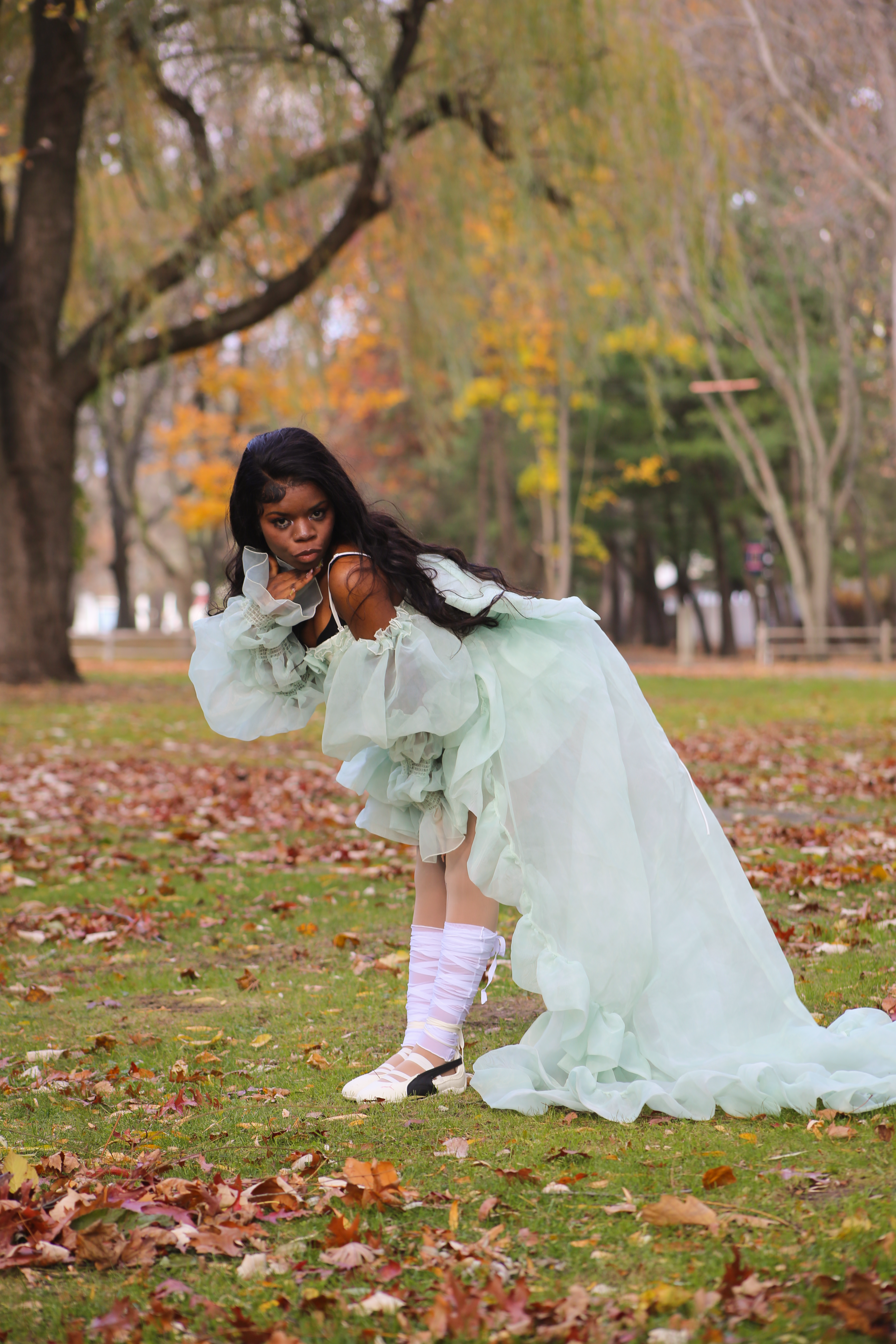 Young Girl in Flowing Green Dress in Fall Park · Free Stock Photo