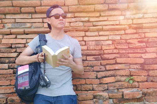 Man Holding Book Outdoor