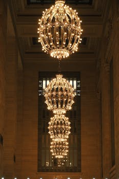 Grand Central Terminal's glowing chandeliers exude historic elegance in New York City.