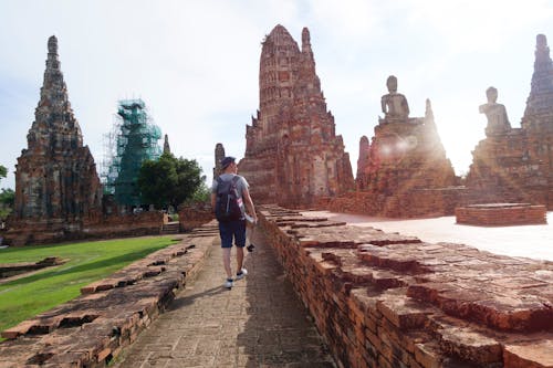 Man Walking Beside Ruins