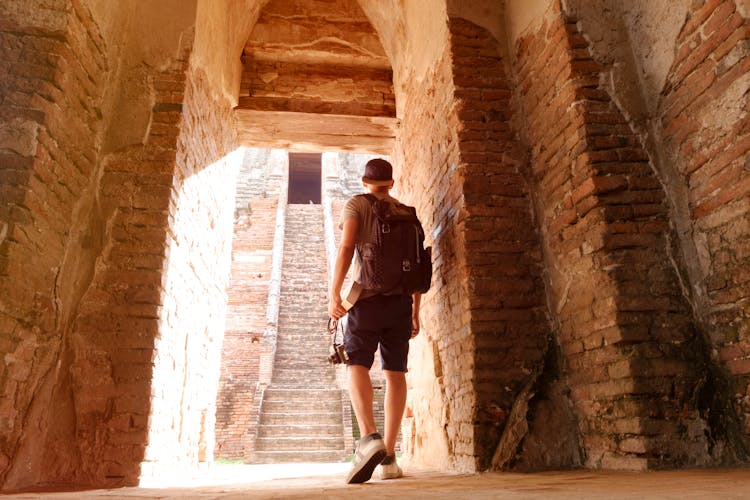 Man Walking Towards Arc