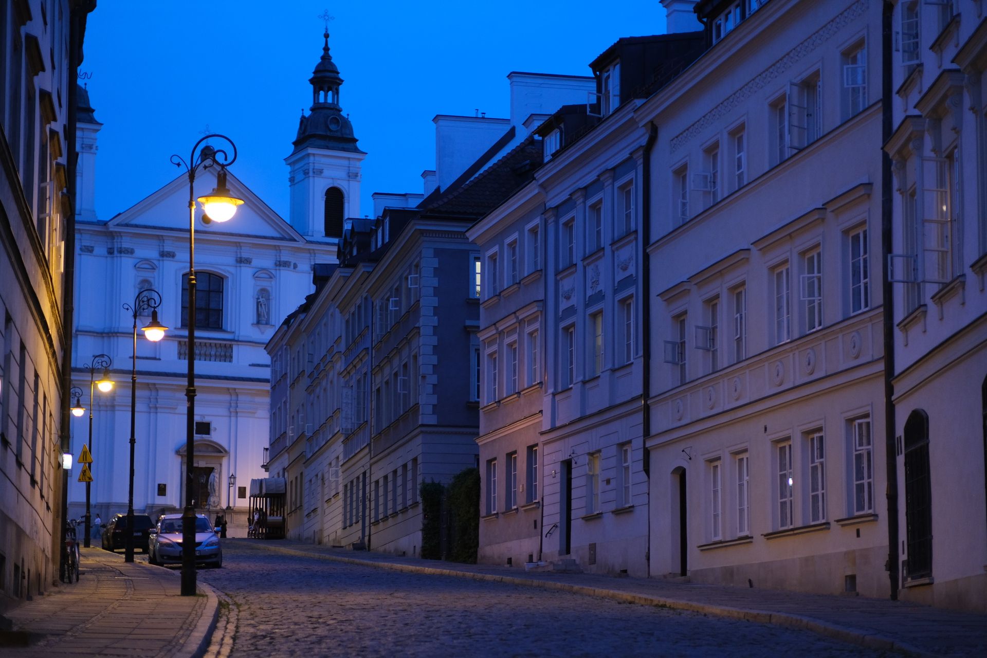 Warsaw old town skyline at dusk with city lights