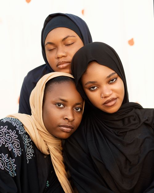 Free Three women in hijabs showing unity and diversity in a close-up portrait. Stock Photo