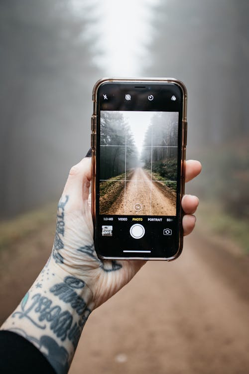 Free Photo of Person Holding Mobile Phone Stock Photo