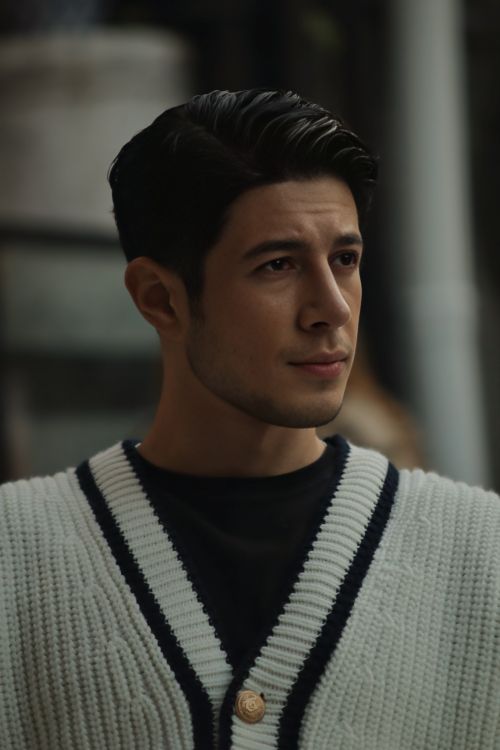 Free A thoughtful young man gazing into the distance in an outdoor setting, exuding confidence. Stock Photo