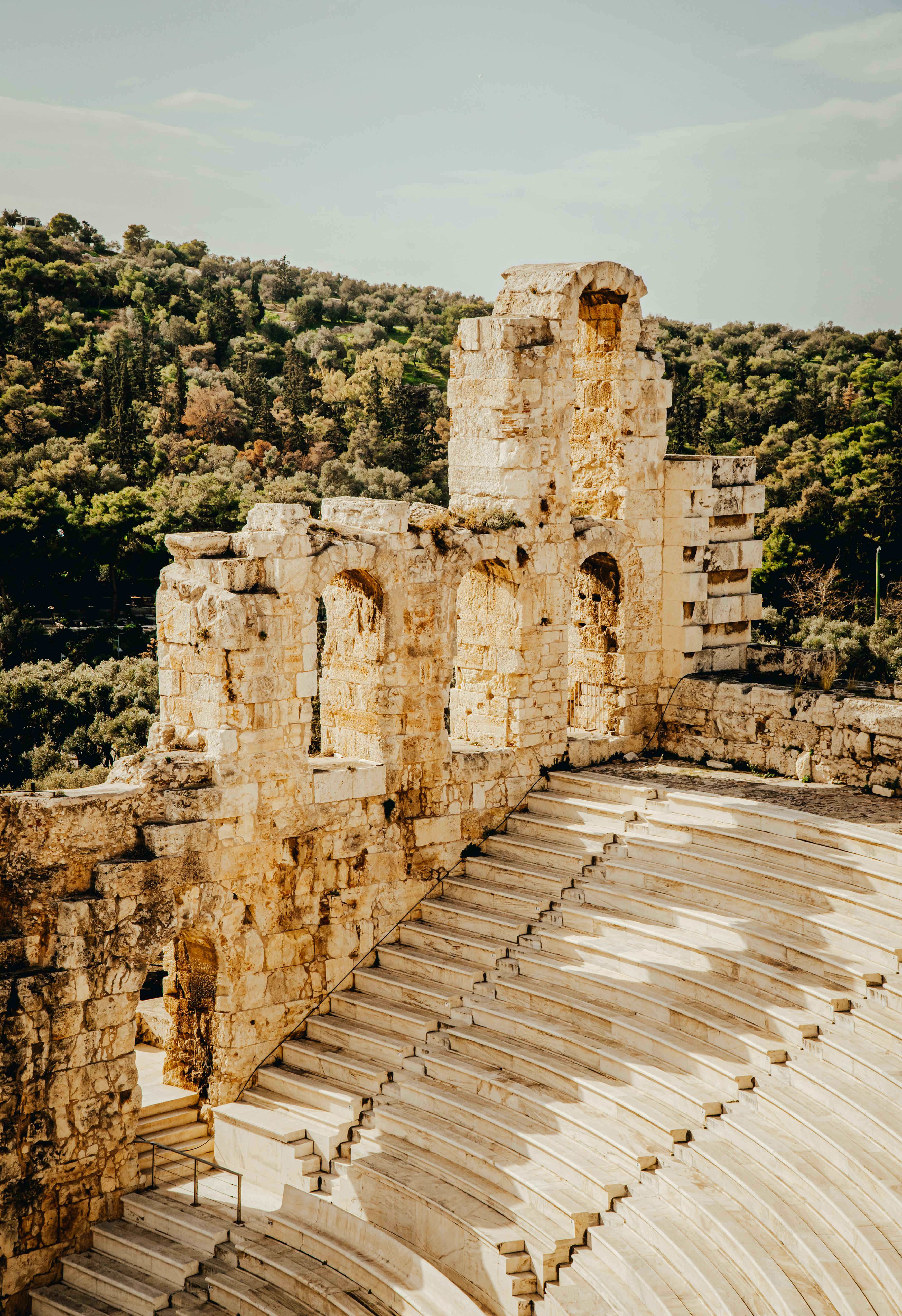 Free Capture of a historic Greek theater amid lush landscapes in Athens, Greece. Stock Photo