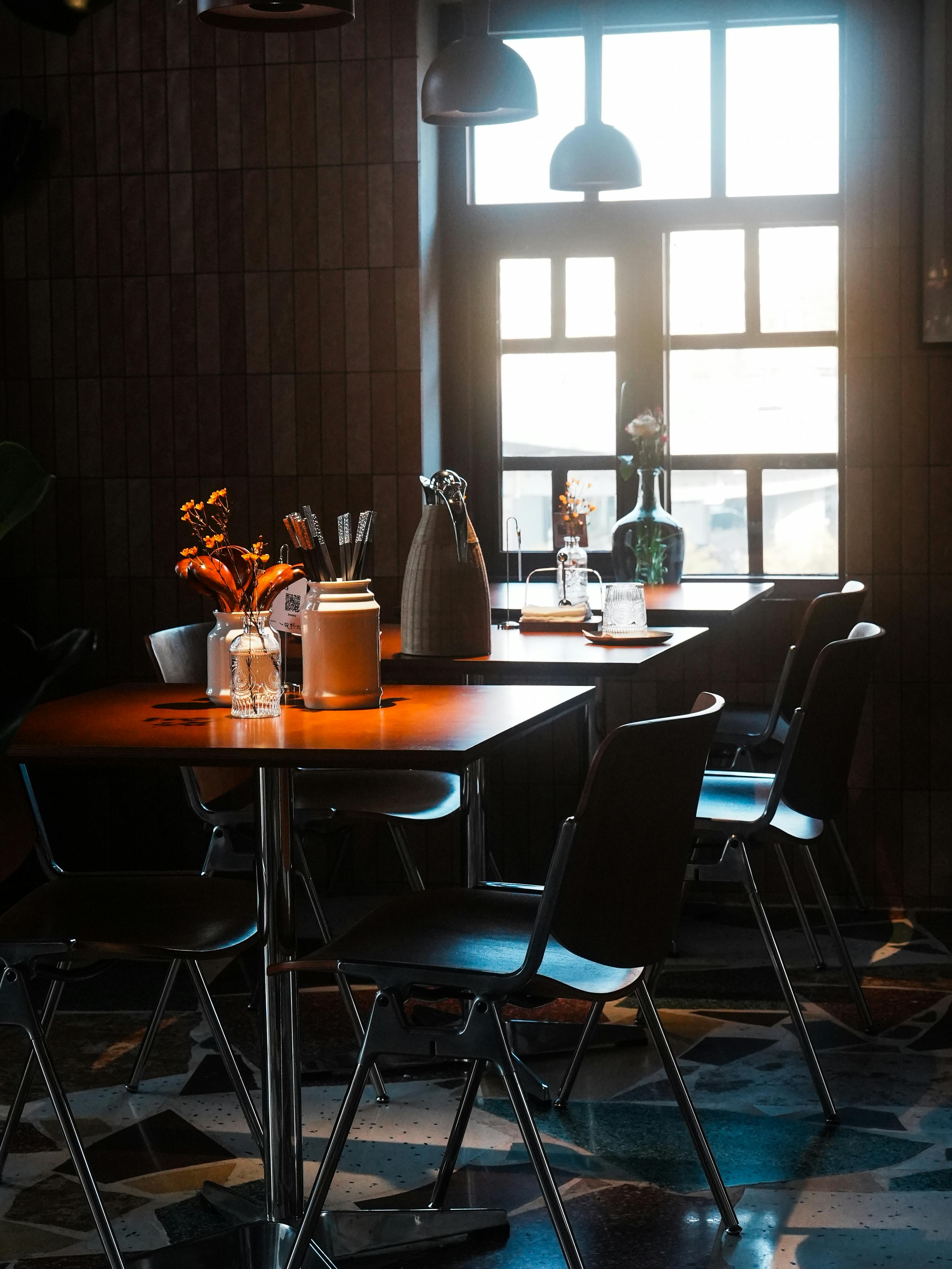 Charming cafe with vintage decor and sunlight streaming through the window.