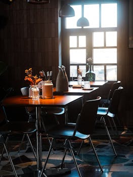 Charming cafe with vintage decor and sunlight streaming through the window.
