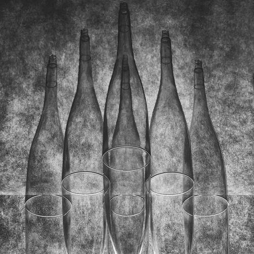 Free Abstract black and white image of bottles and glasses creating geometric patterns. Stock Photo