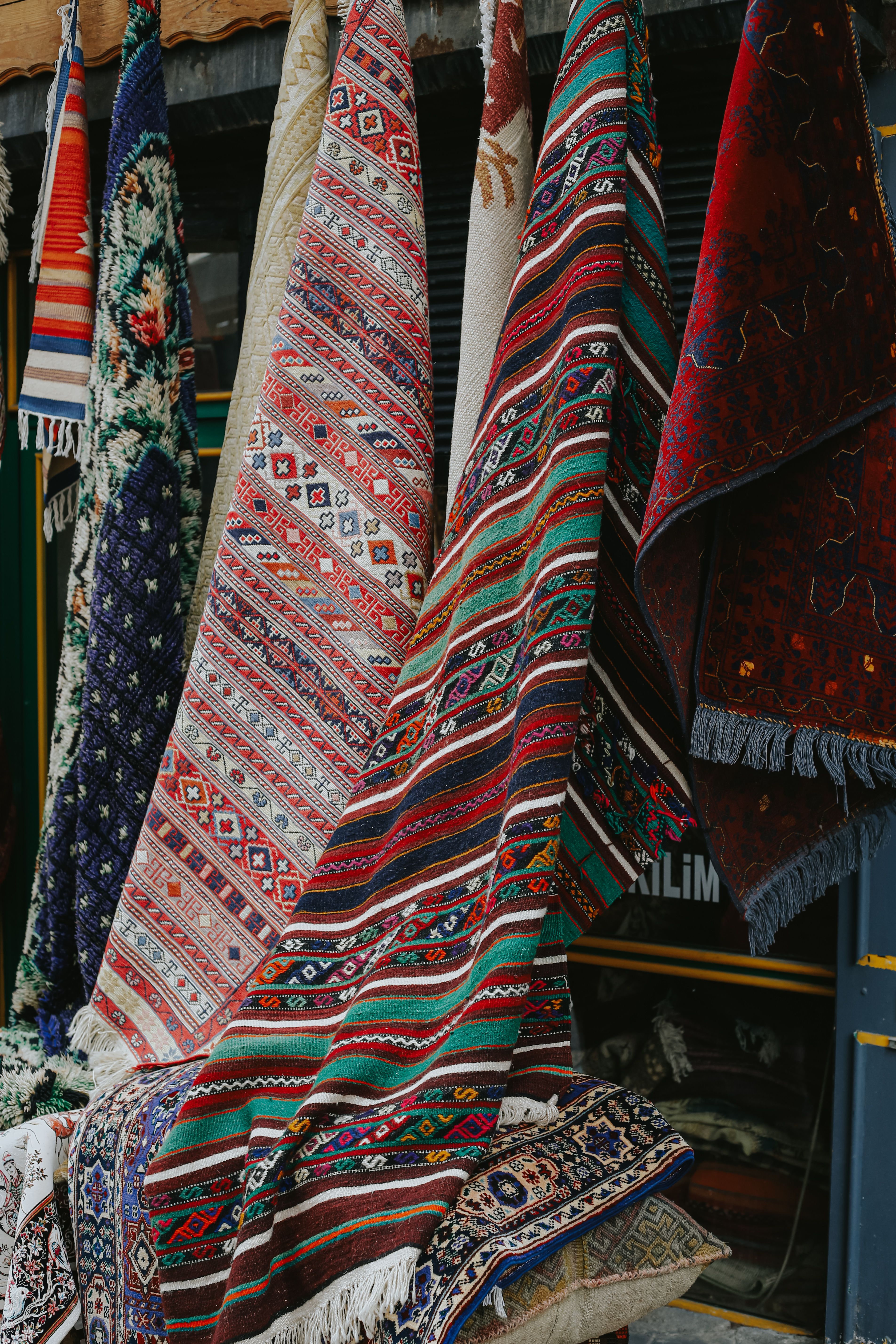 Colorful Traditional Rugs Displayed in Market · Free Stock Photo