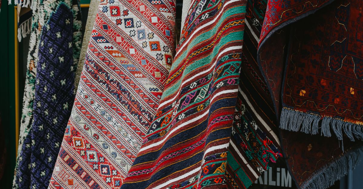 Market Rug Colorful Traditional Rugs Displayed in Market · Free Stock Photo