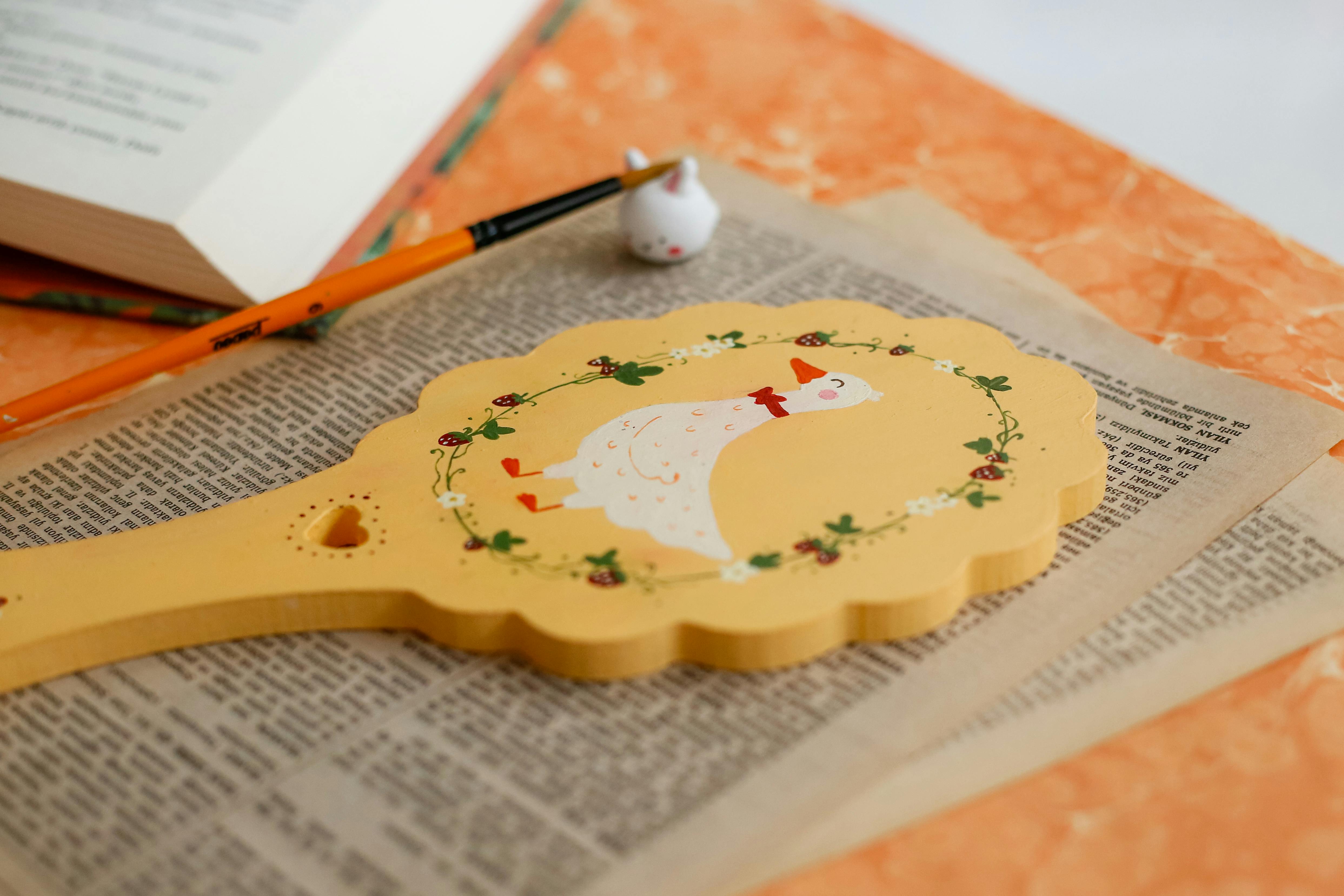 Charming vintage wooden token with duck illustration, perfect for decor or craft.