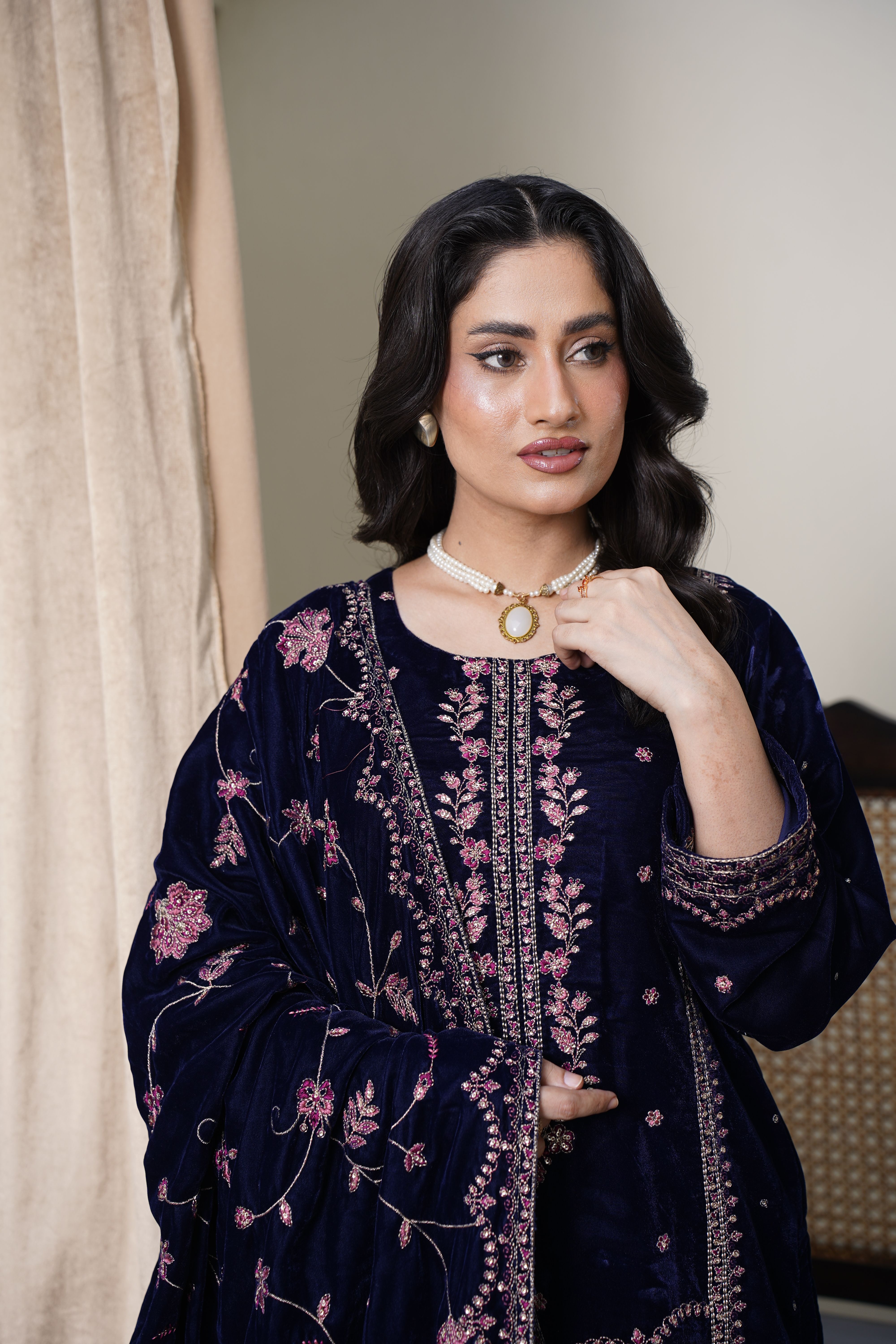 A fashion model in intricate velvet eastern dress captured indoors, Lahore.