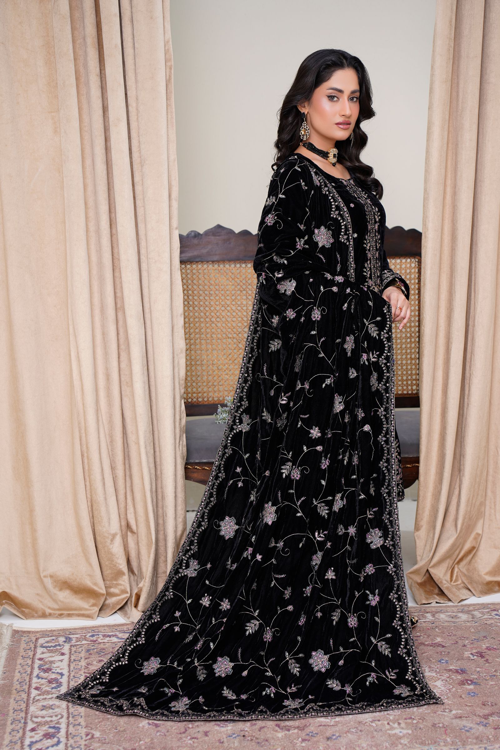 Model wearing luxury black embroidered fashion