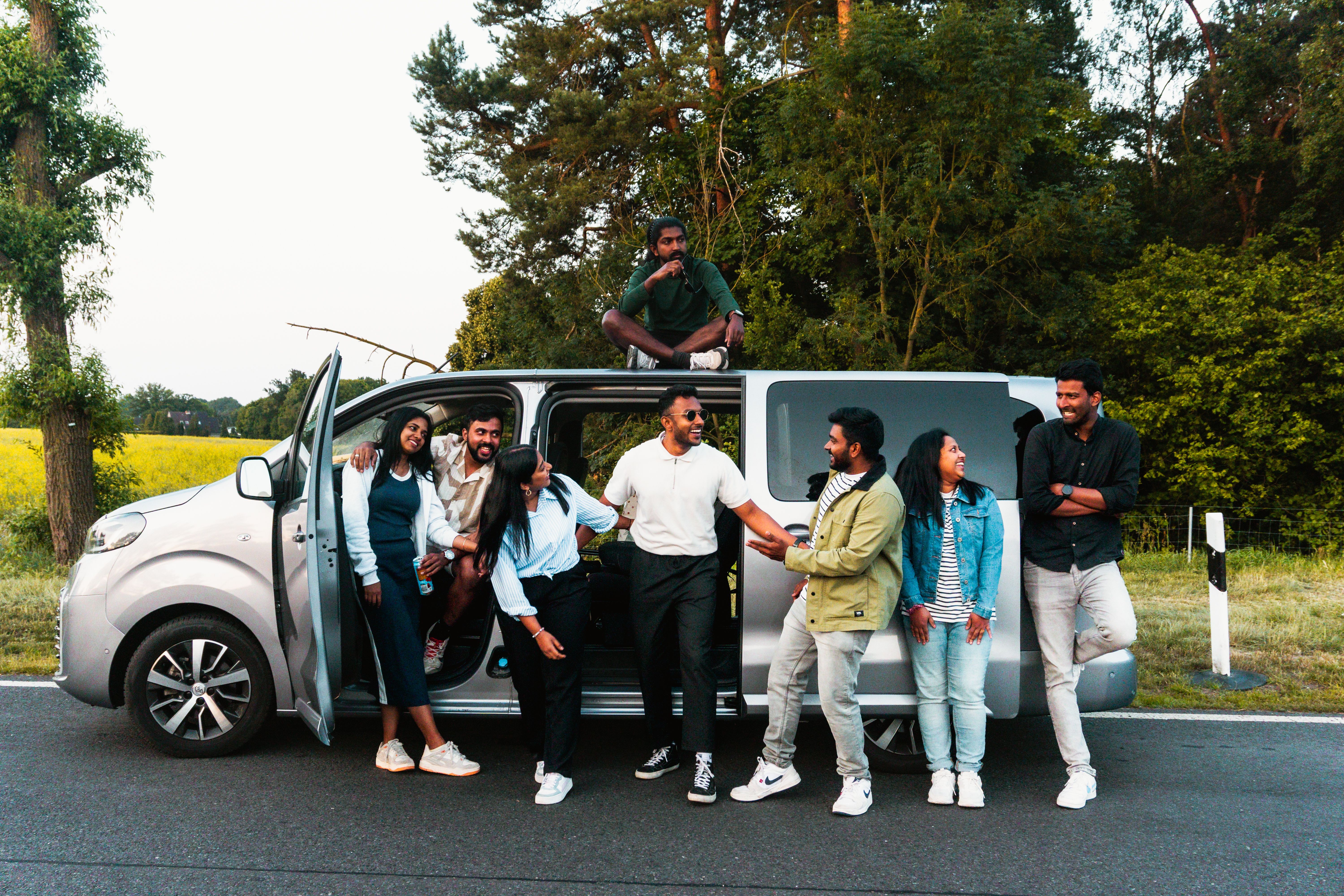 Group of Friends Enjoying a Road Trip Outdoors · Free Stock Photo