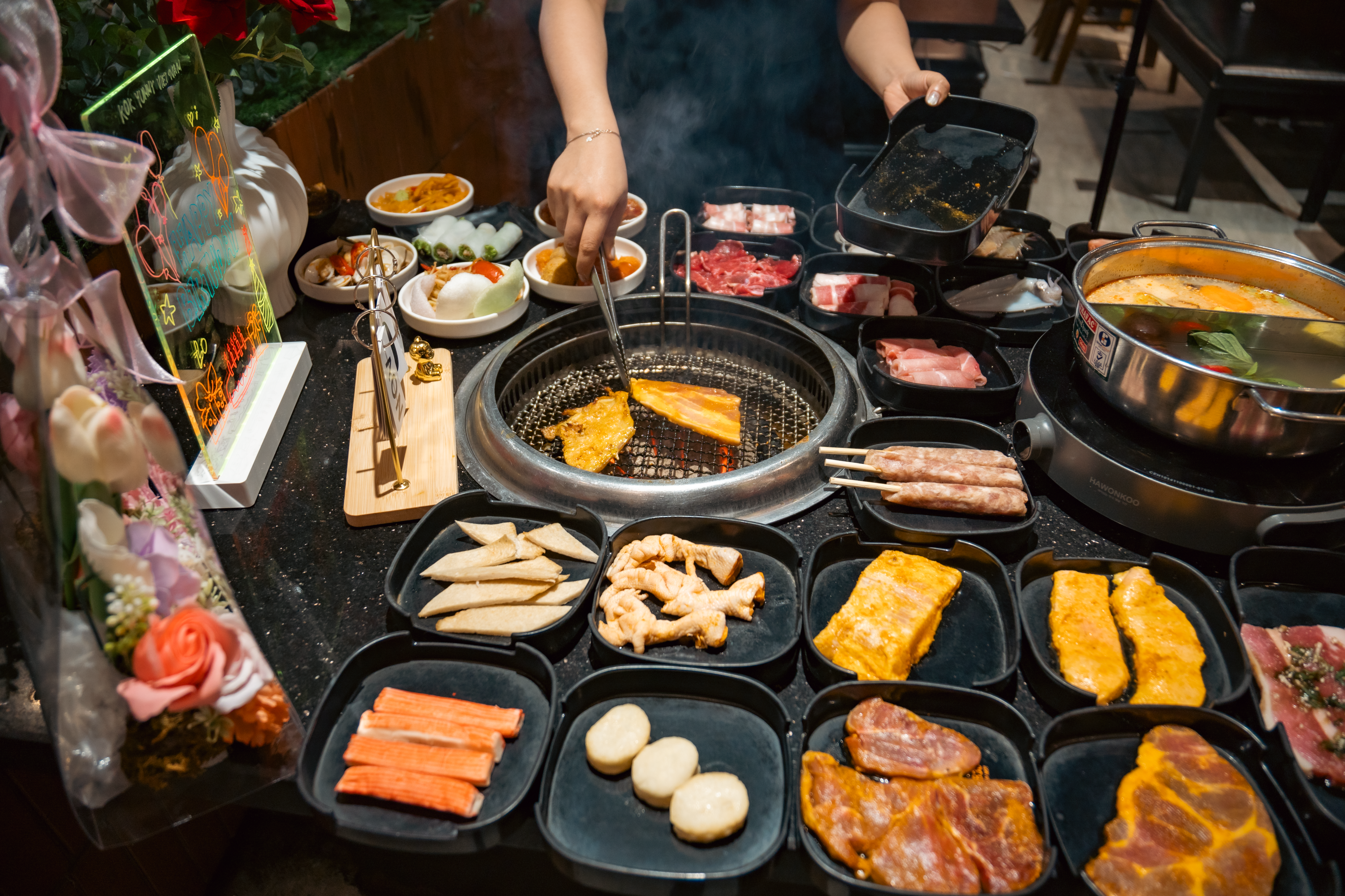 Assortment of Korean BBQ meats and side dishes