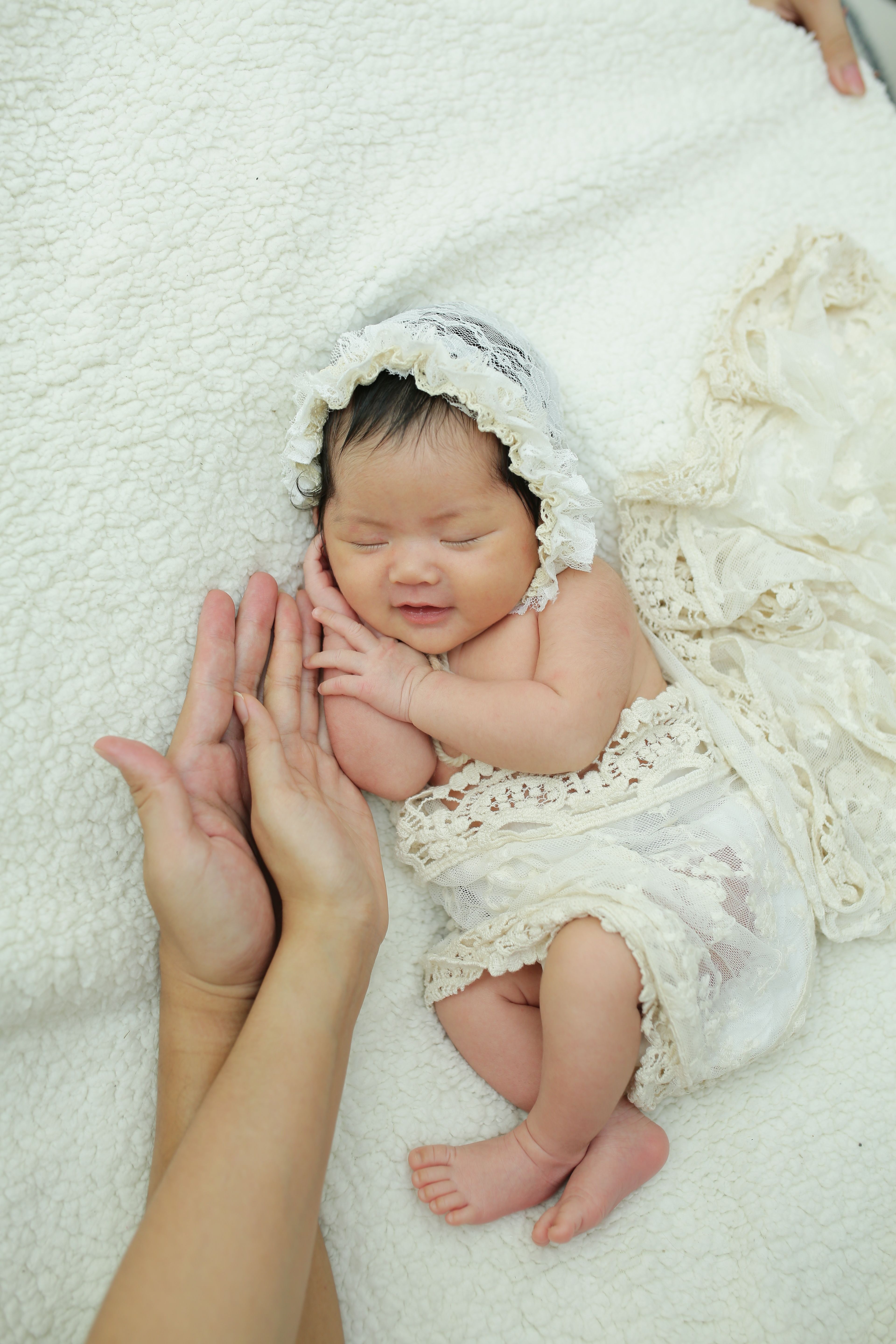 A newborn in soft, warm tones