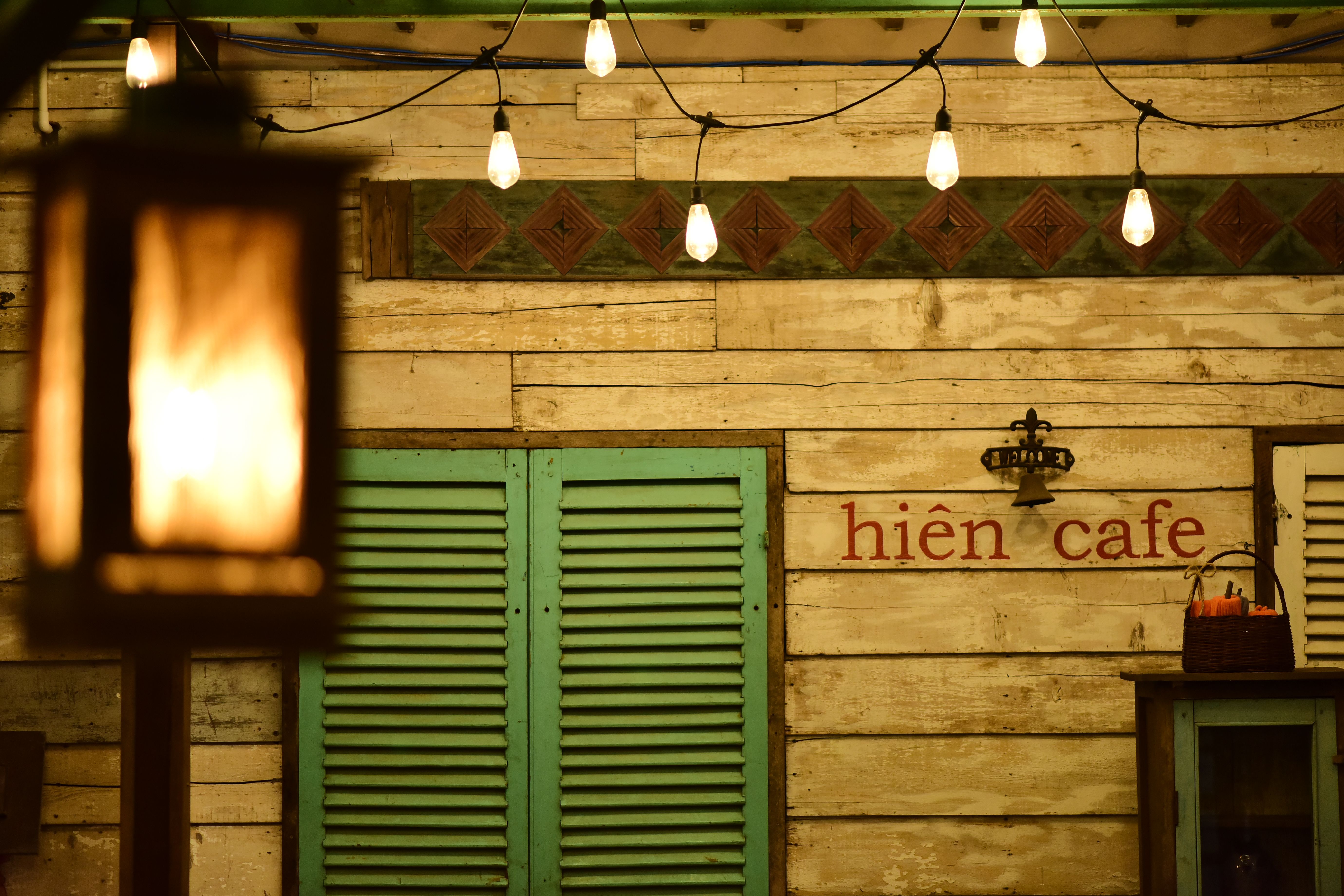 Cozy Vintage Cafe Exterior with Warm Lighting · Free Stock Photo