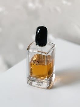 A stylish shot of an Armani Si perfume bottle with an elegant design and amber liquid.