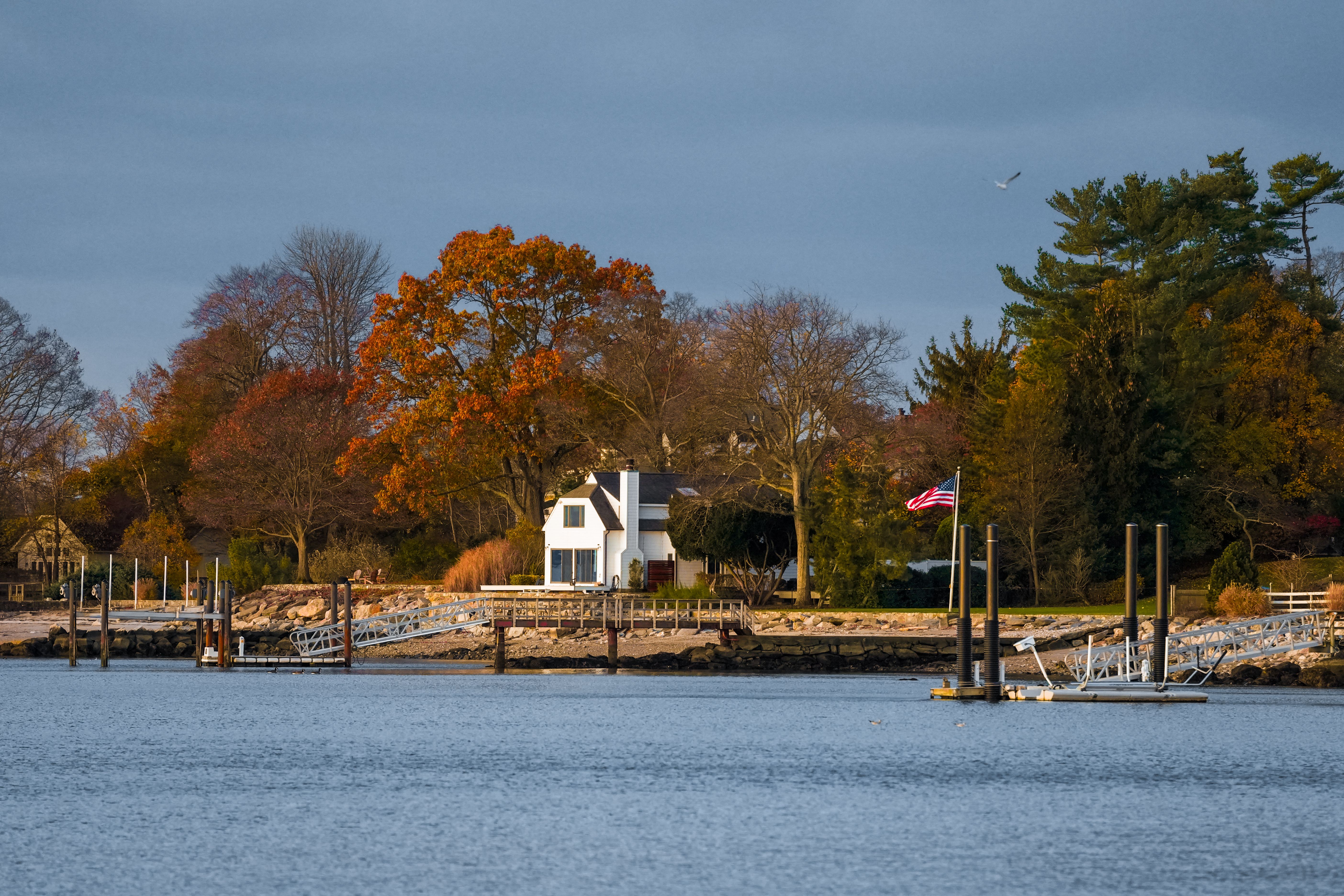 Tranquil autumn waterfront scene in Stamford, capturing vibrant fall colors and serene water views.