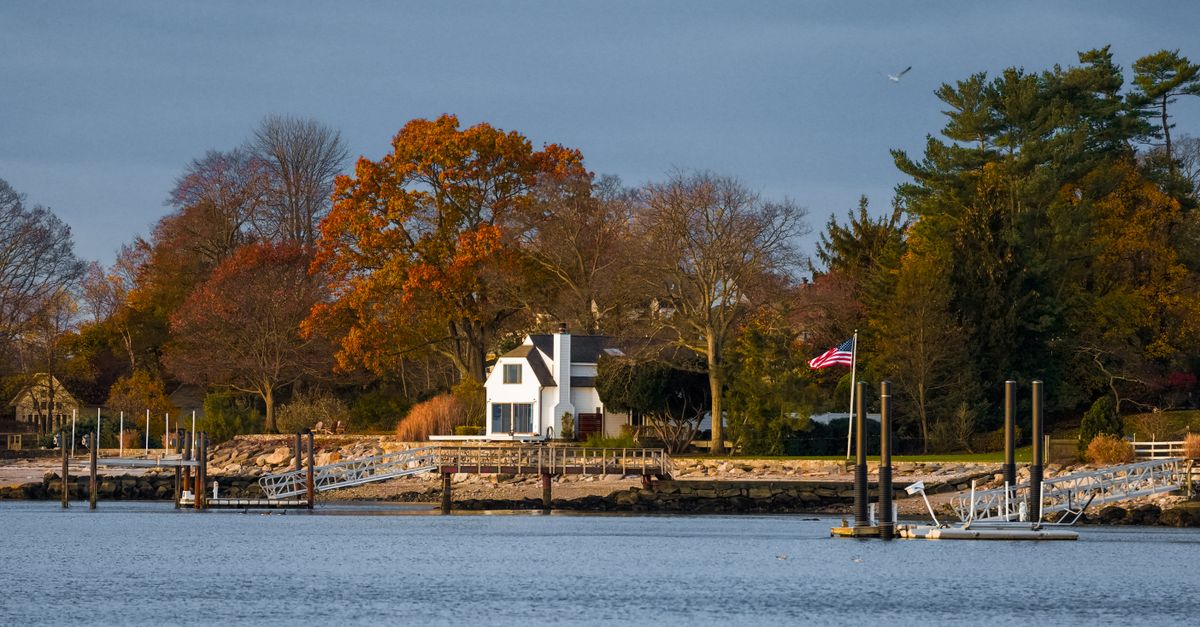Tranquil autumn waterfront scene in Stamford, capturing vibrant fall colors and serene water views.